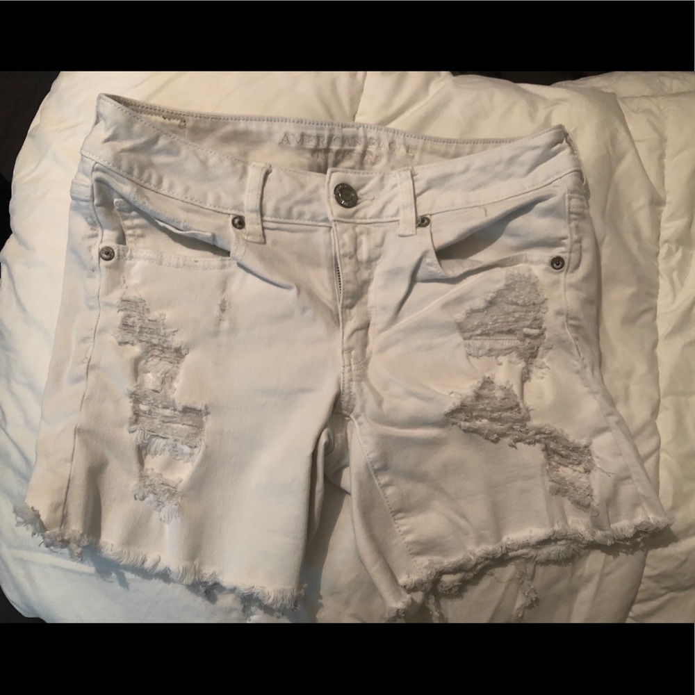 White ripped denim shorts